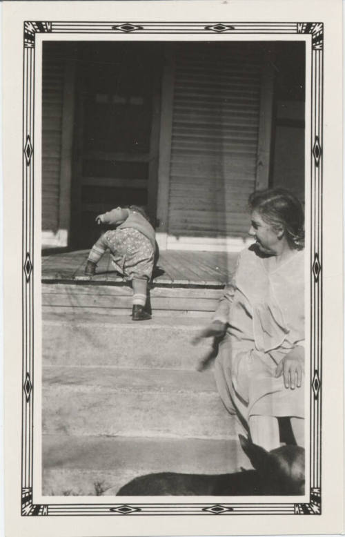 Young Child Trying to Climb Stairs