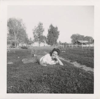 A Lady Laying on the Grass