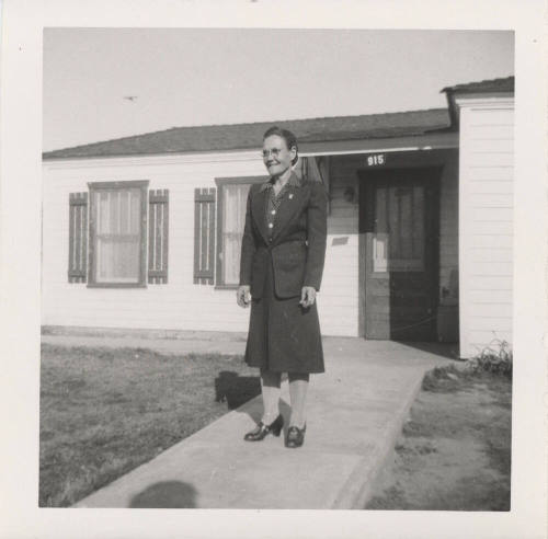 A Lady Standing in Front of a Home