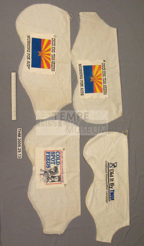 Four of Chuck King's Iditarod dog bibs