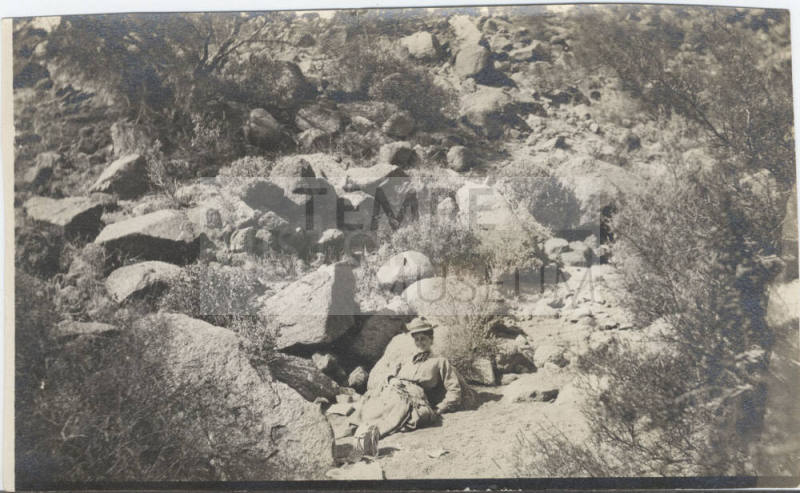 View of a Woman Sitting in the Desert