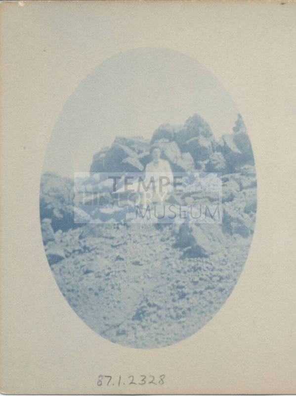 Unidentified Women Sitting on a Rock
