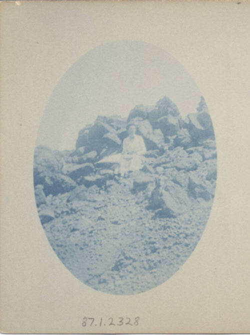 Unidentified Women Sitting on a Rock