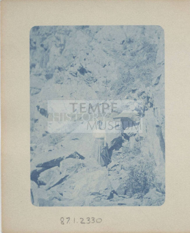 Unidentified Woman Standing by Rocks