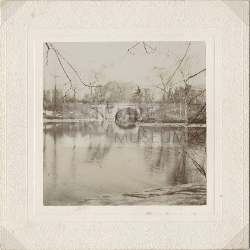 View of Arched Bridge with Lake in Front