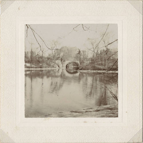 View of Arched Bridge with Lake in Front