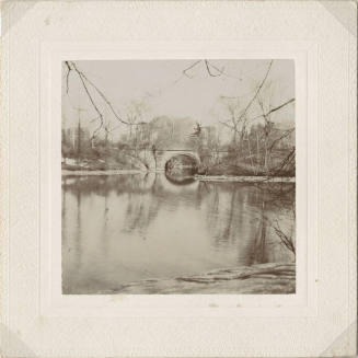 View of Arched Bridge with Lake in Front