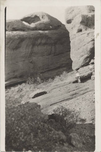 View of People by a Rock Formation, AZ