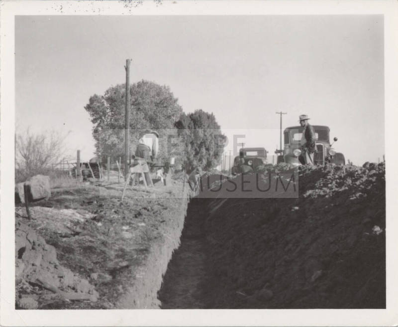 4 Men Working in and Near Trench