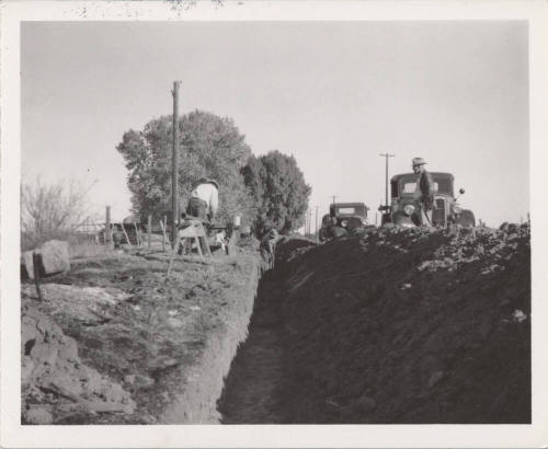 4 Men Working in and Near Trench
