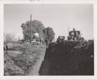 4 Men Working in and Near Trench