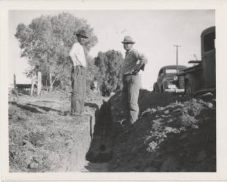 Three Workmen in Front of Trencher
