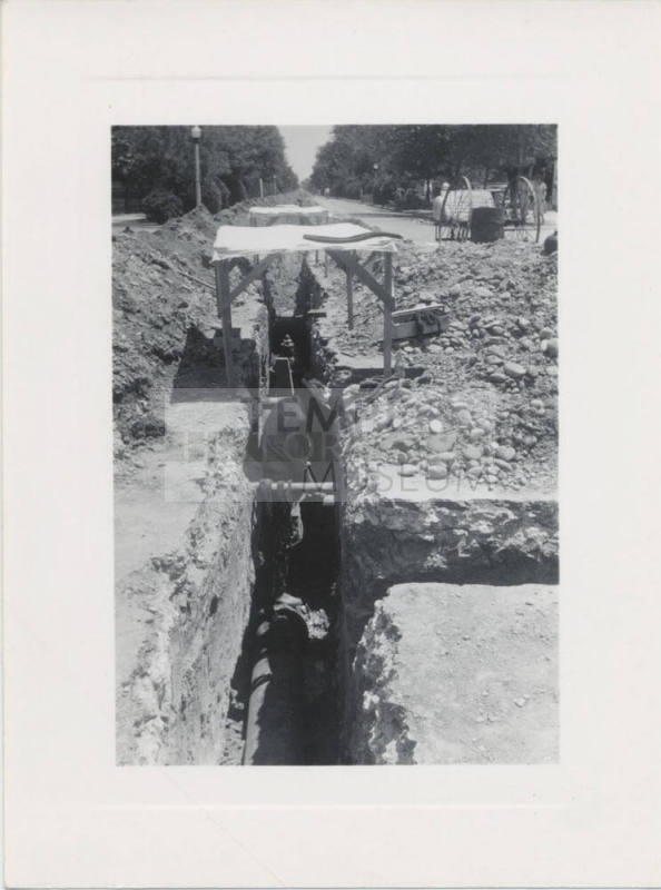Public Works Employee Working in Trench