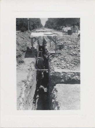 Public Works Employee Working in Trench