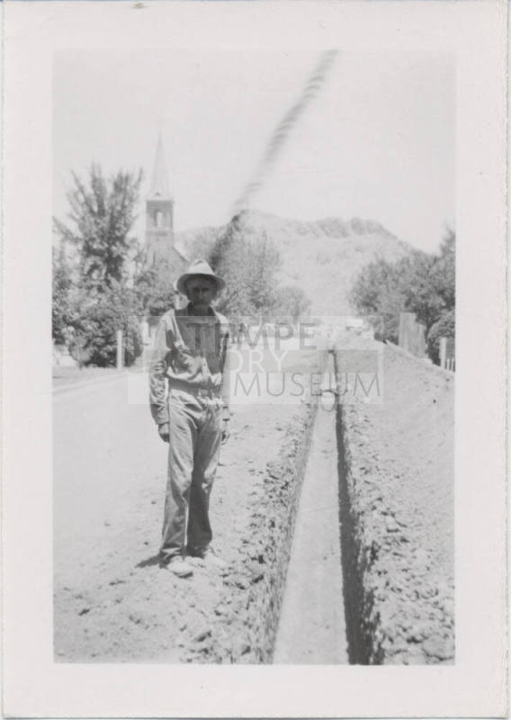 Man Next to Trench on College Avenue