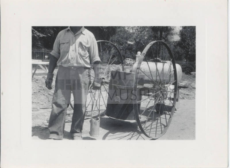 Man in Front of Barrel Cart