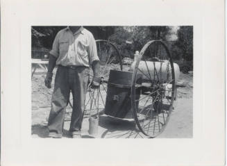 Man in Front of Barrel Cart
