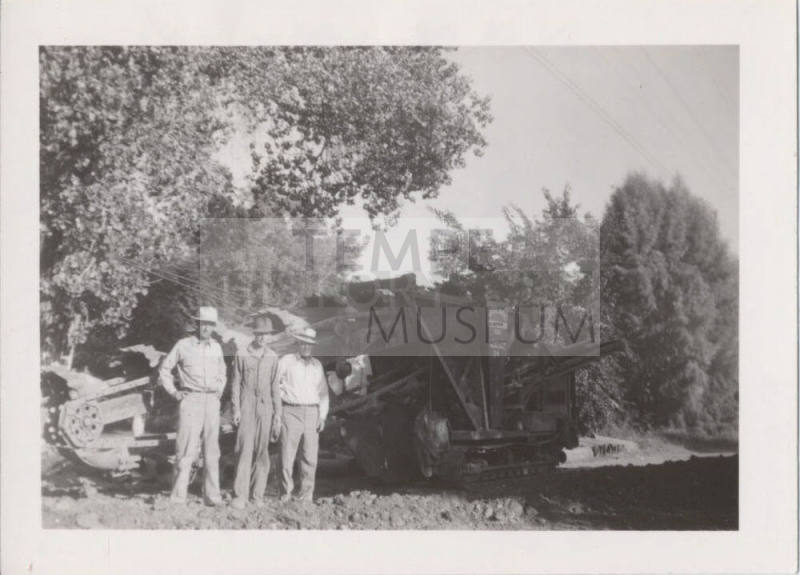 3 Men in Front of Trenching Machine