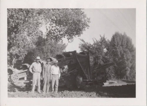 3 Men in Front of Trenching Machine