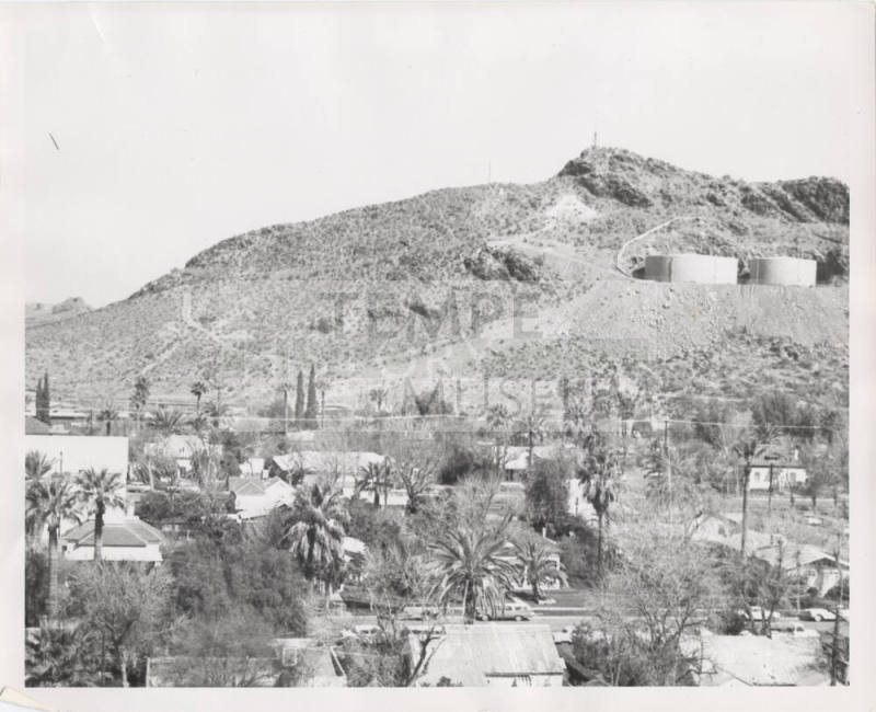Photograph, looking north to Tempe Butte and 2 water tanks with residential neighborhood in foreground.
