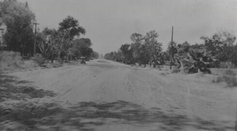 Dirt road with cars
