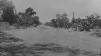 Dirt road with cars