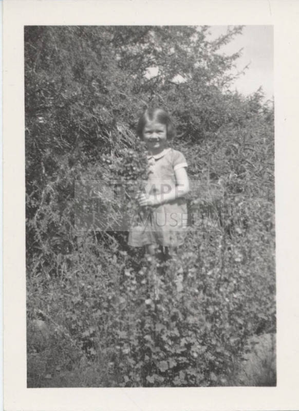 Betty Allen Standing Holding Flowers