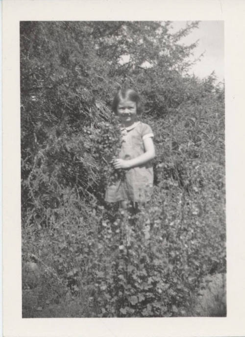 Betty Allen Standing Holding Flowers