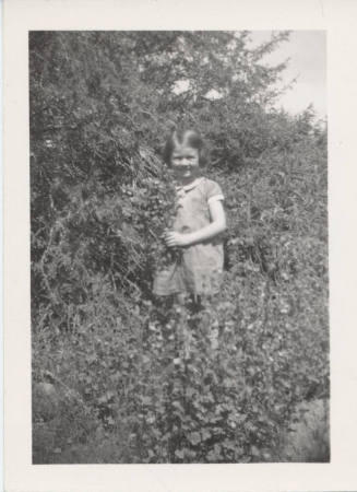 Betty Allen Standing Holding Flowers