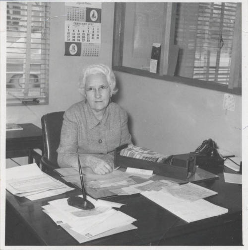 Miss Barbre Working at Her Library Desk