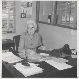 Miss Barbre Working at Her Library Desk