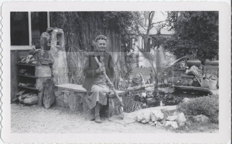 Guess Birchett Seated Beside Garden Pond