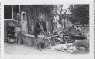 Guess Birchett Seated Beside Garden Pond