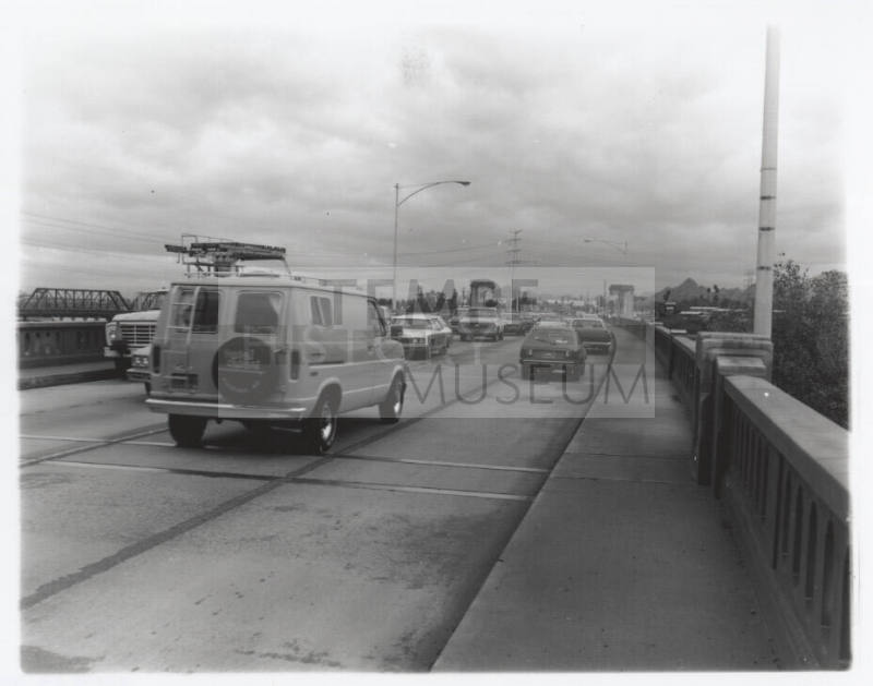 Cars on the Mill Avenue bridge