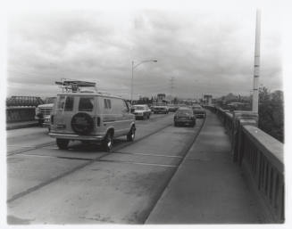 Cars on the Mill Avenue bridge