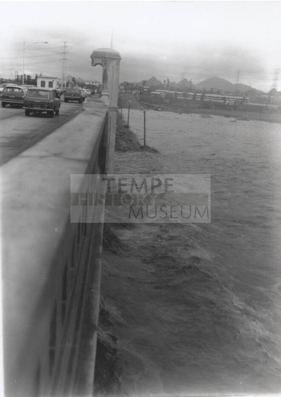 Vertical shot of flooded Salt River from the Mill Avenue Bridge