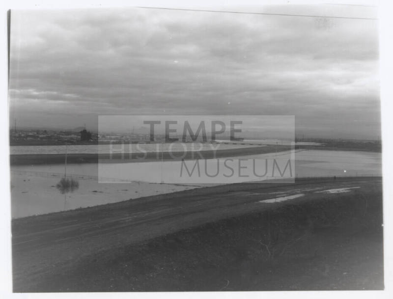 view of river, dirt road foreground