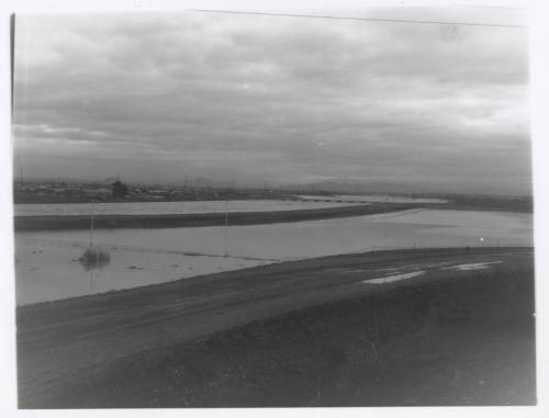 view of river, dirt road foreground
