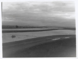 view of river, dirt road foreground
