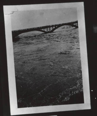 Salt River flood waters under the Ash Avenue bridge