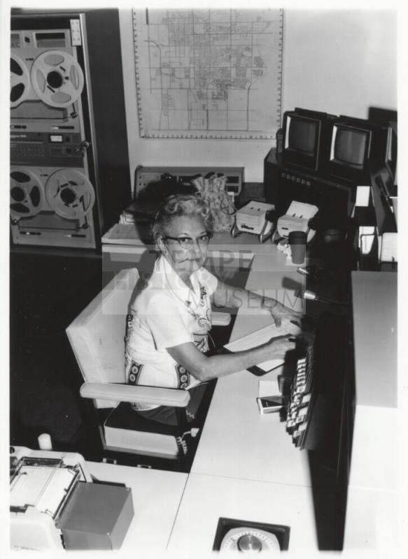Pauline Hill Smith working in the Tempe Police Department radio room