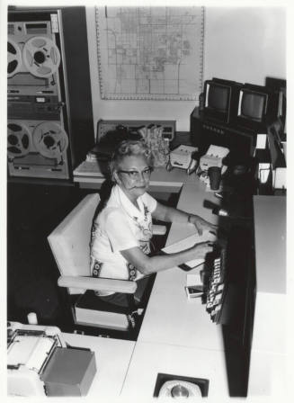 Pauline Hill Smith working in the Tempe Police Department radio room