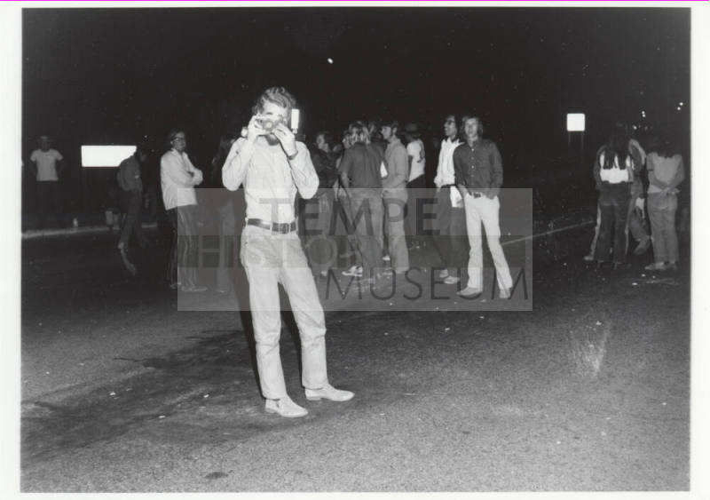 Demonstration march, 5-5-1971--Man w/camera taking photo of photographer at night