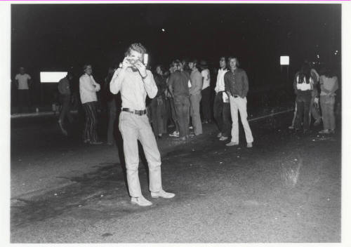 Demonstration march, 5-5-1971--Man w/camera taking photo of photographer at night