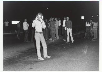 Demonstration march, 5-5-1971--Man w/camera taking photo of photographer at night