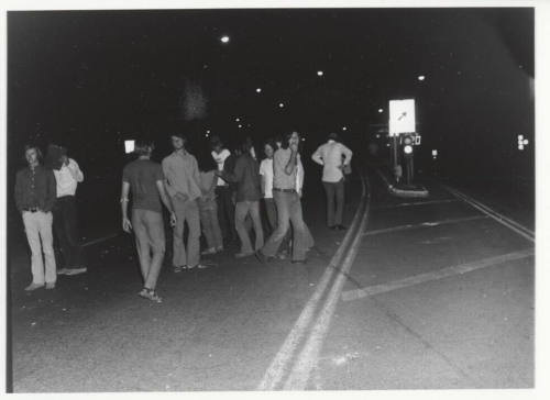 Demonstration march, 5-5-1971--Group of men blocking road lane at night
