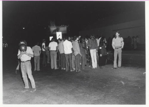 Demonstration march, 5-5-1971--Group of people clustered at night
