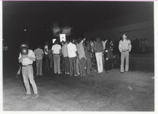 Demonstration march, 5-5-1971--Group of people clustered at night