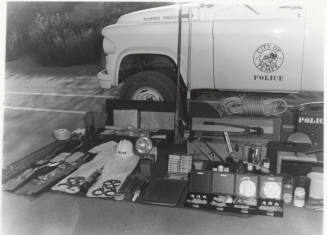 view of contents Tempe Police wagon on the ground