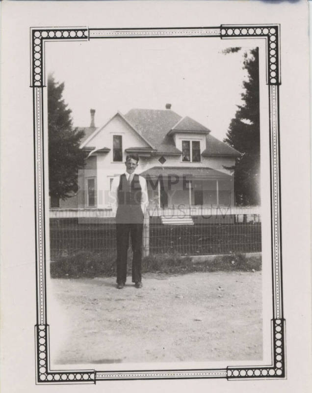Willard Carter in Front of Residence